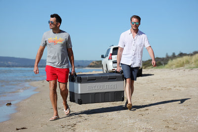 85L The Adventurer - Dual Zone myCOOLMAN fridge being carried between two men on beack